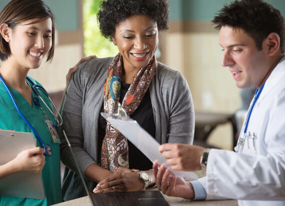 doctor conversing with two women